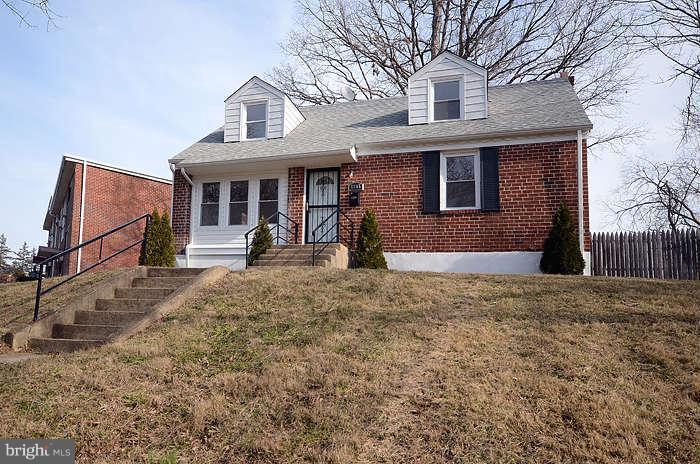 4305 Wakefield Road Baltimore, MD 21216 - Photo 1 of 25 a front view of a house with a yard