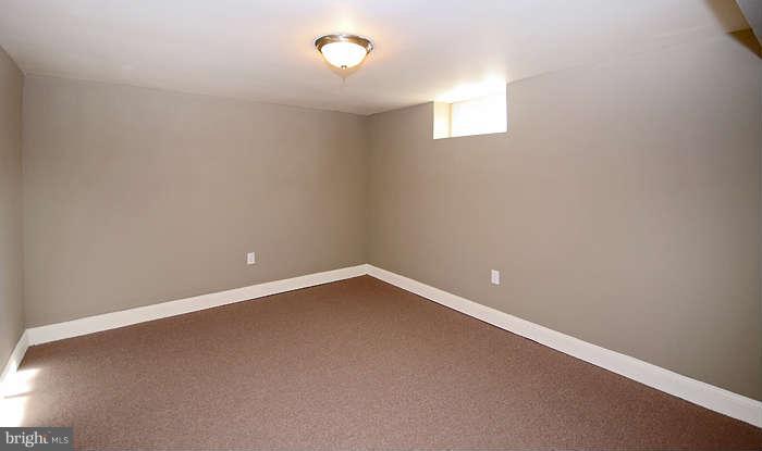 4305 Wakefield Road Baltimore, MD 21216 - Photo 19 of 25 a view of an empty room with a window