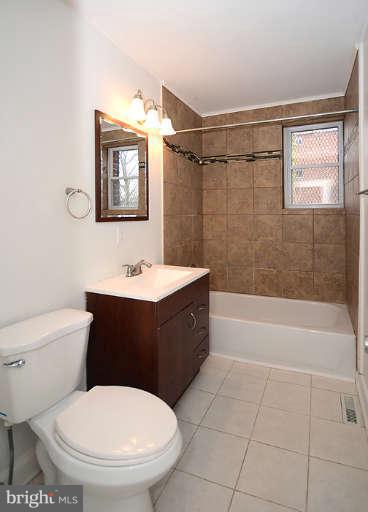 4305 Wakefield Road Baltimore, MD 21216 - Photo 3 of 25 a bathroom with a sink a toilet and shower
