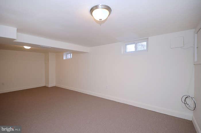 4305 Wakefield Road Baltimore, MD 21216 - Photo 22 of 25 a view of an empty room with a window