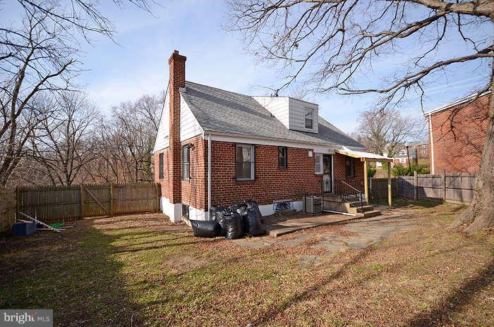 4305 Wakefield Road Baltimore, MD 21216 - Photo 24 of 25 a front view of a house with a yard