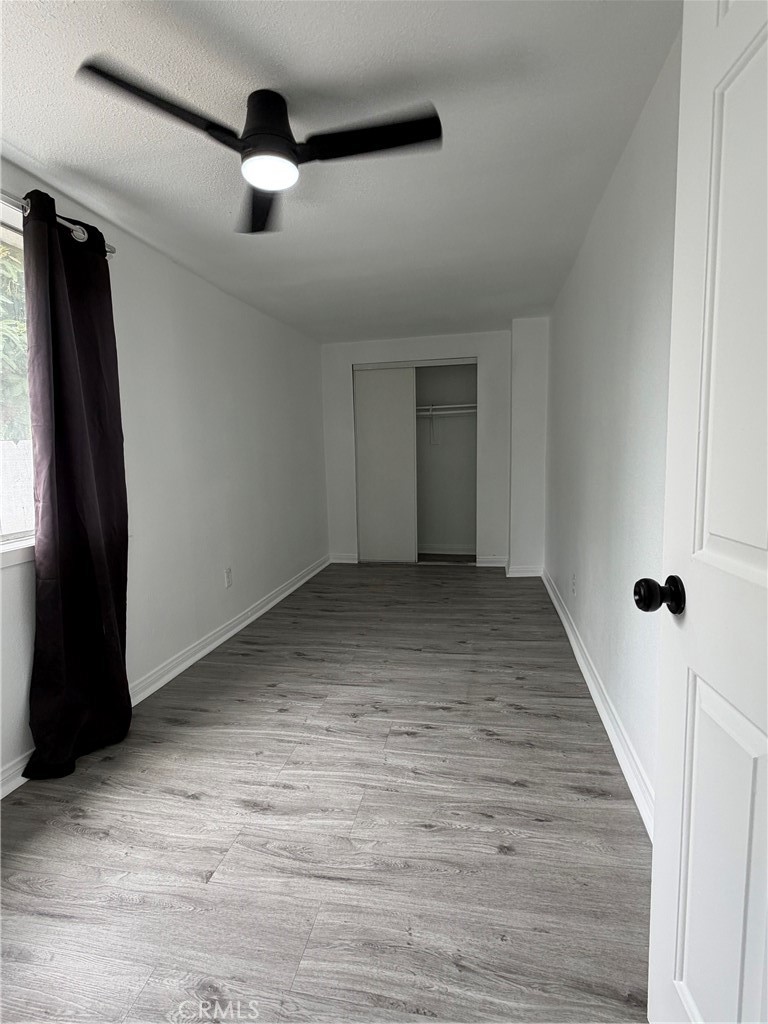 304 West Cedar Street Compton, CA 90220 - Photo 2 of 9 wooden floor in an empty room