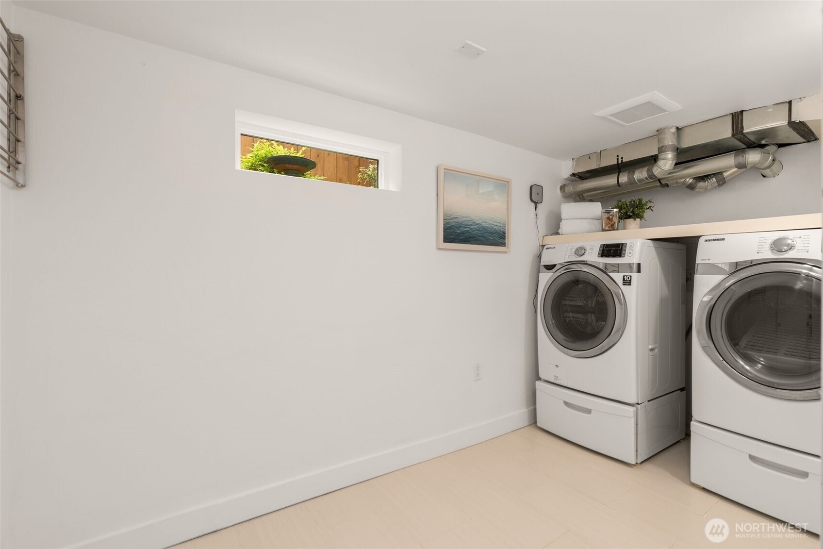 170 Lynn Street Seattle, WA 98109 - Photo 29 of 40 a utility room with dryer and washer