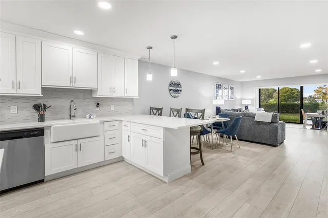 a view of a lake and houses in the background