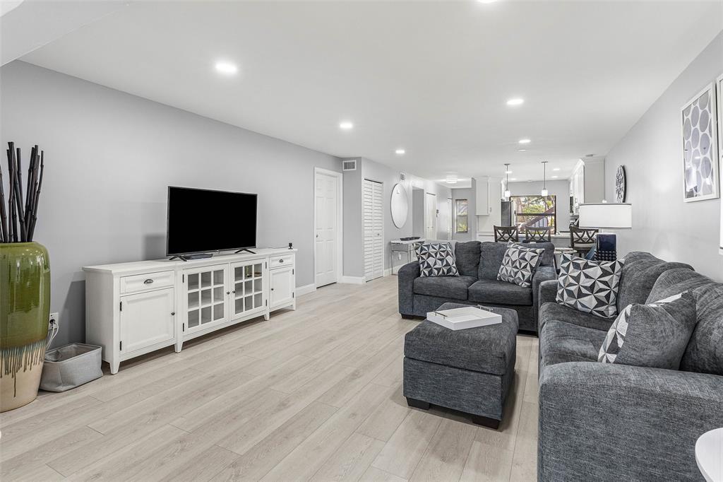 9286 Vista Del Lago, Unit E Boca Raton, FL 33428 - Photo 12 of 26 a living room with furniture and a flat screen tv