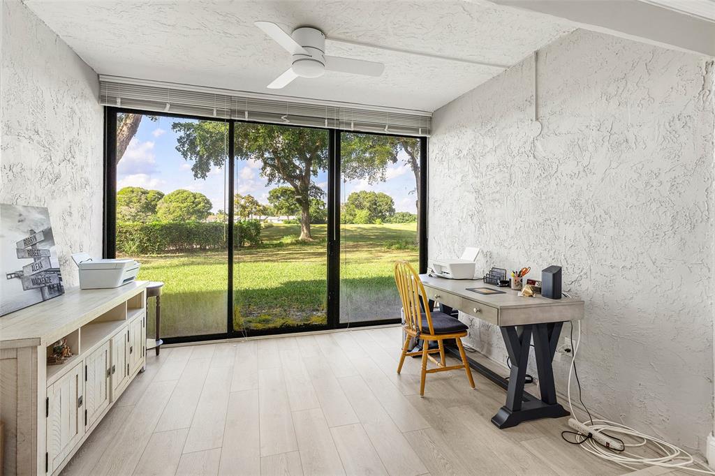9286 Vista Del Lago, Unit E Boca Raton, FL 33428 - Photo 13 of 26 a view of a room with furniture and large windows