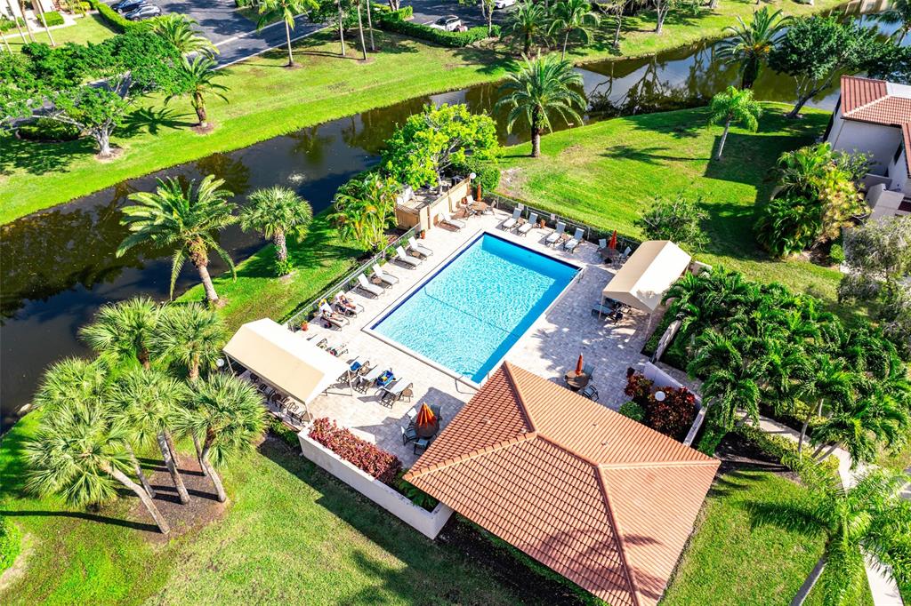 9286 Vista Del Lago, Unit E Boca Raton, FL 33428 - Photo 22 of 26 a view of a chairs and table in the garden