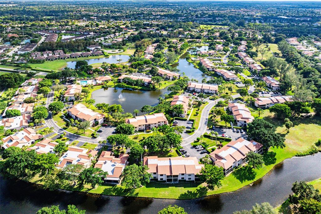 9286 Vista Del Lago, Unit E Boca Raton, FL 33428 - Photo 24 of 26 an aerial view of residential houses with outdoor space and swimming pool