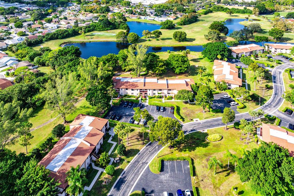 9286 Vista Del Lago, Unit E Boca Raton, FL 33428 - Photo 25 of 26 an aerial view of residential houses with outdoor space and swimming pool