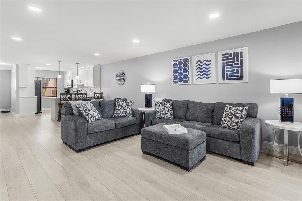 9286 Vista Del Lago, Unit E Boca Raton, FL 33428 - Photo 10 of 26 a living room with furniture and a wooden floor