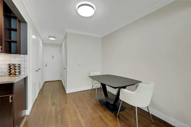 a view of a hallway with seating area