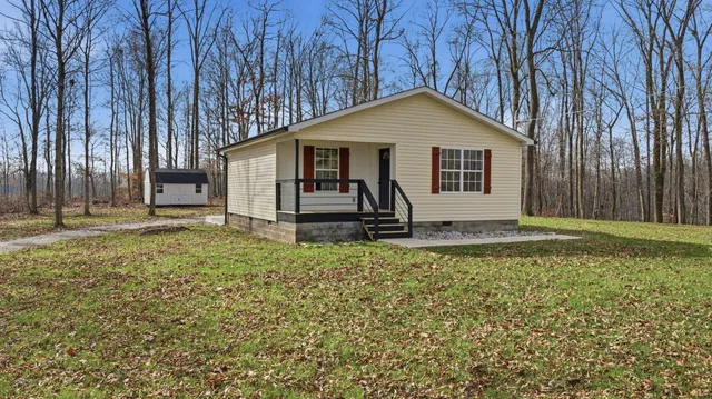 a house with trees in the background
