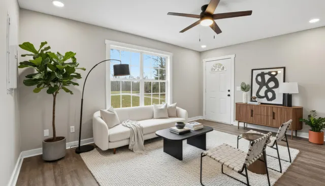 an empty room with a window and wooden floor