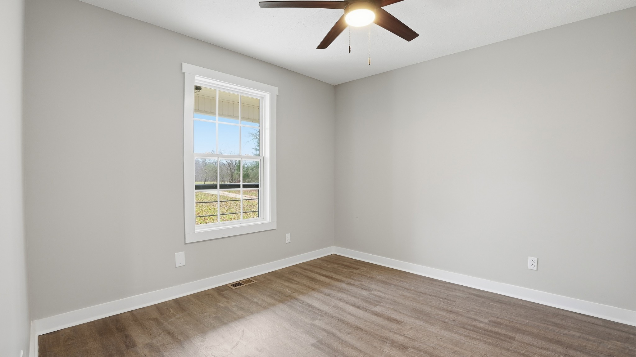 790 Preston Ridge Road Mulberry, TN 37359 - Photo 13 of 44 an empty room with a window and wooden floor
