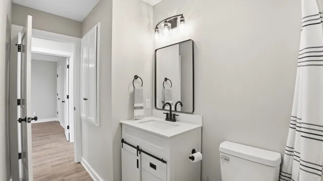 an empty room with cabinet and windows