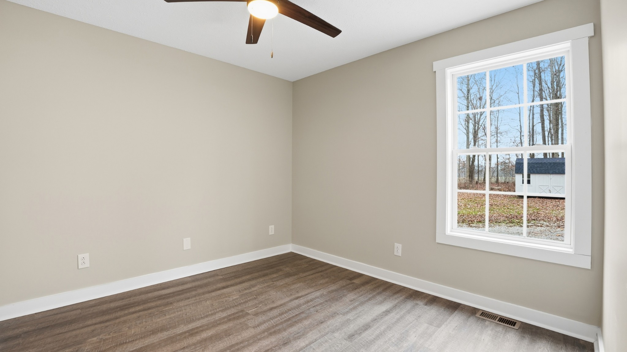 790 Preston Ridge Road Mulberry, TN 37359 - Photo 20 of 44 an empty room with wooden floor and windows