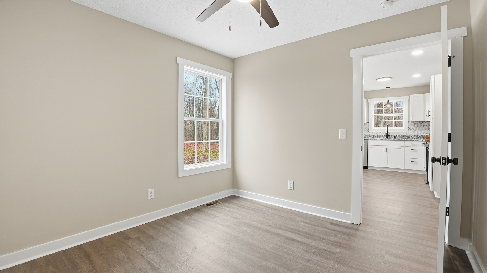 790 Preston Ridge Road Mulberry, TN 37359 - Photo 23 of 44 an empty room with cabinet and windows