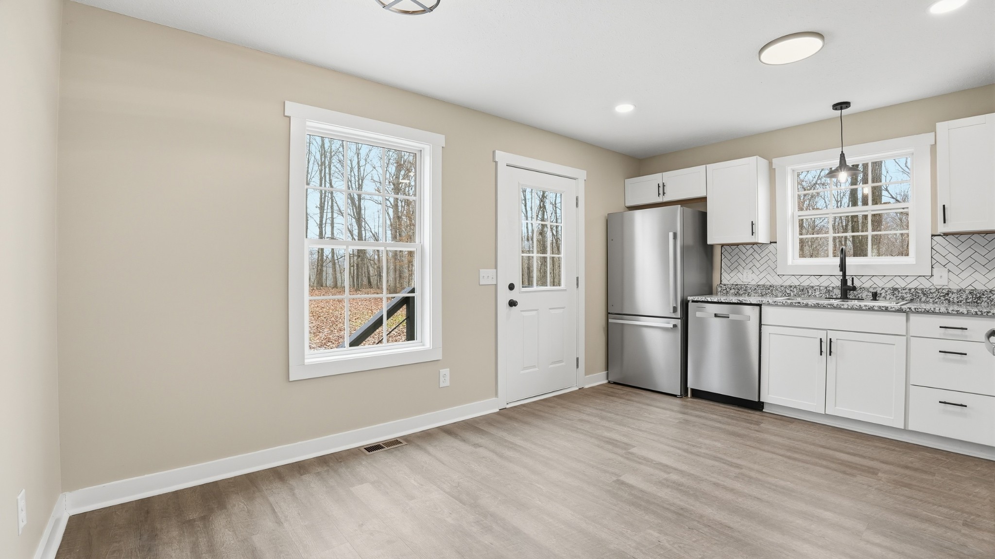 790 Preston Ridge Road Mulberry, TN 37359 - Photo 24 of 44 a kitchen with granite countertop white cabinets and white appliances