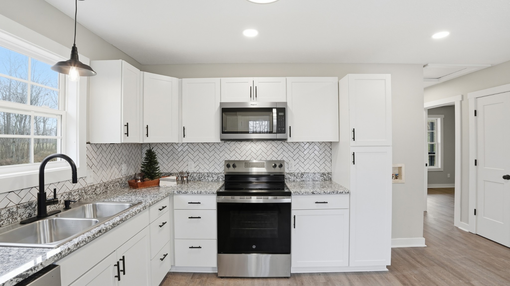 790 Preston Ridge Road Mulberry, TN 37359 - Photo 30 of 44 a kitchen with a sink stove and cabinets