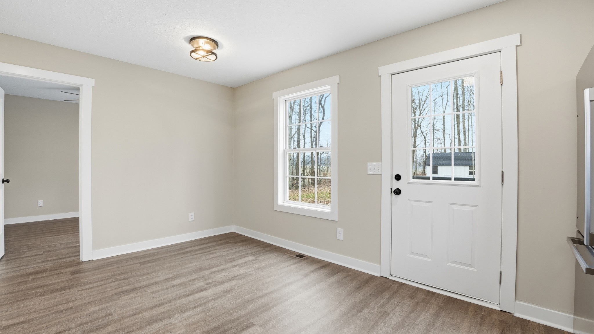 790 Preston Ridge Road Mulberry, TN 37359 - Photo 31 of 44 a view of an empty room with wooden floor and a window