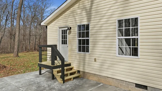 a aerial view of a house with a yard