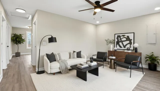 a living room with furniture and a large window
