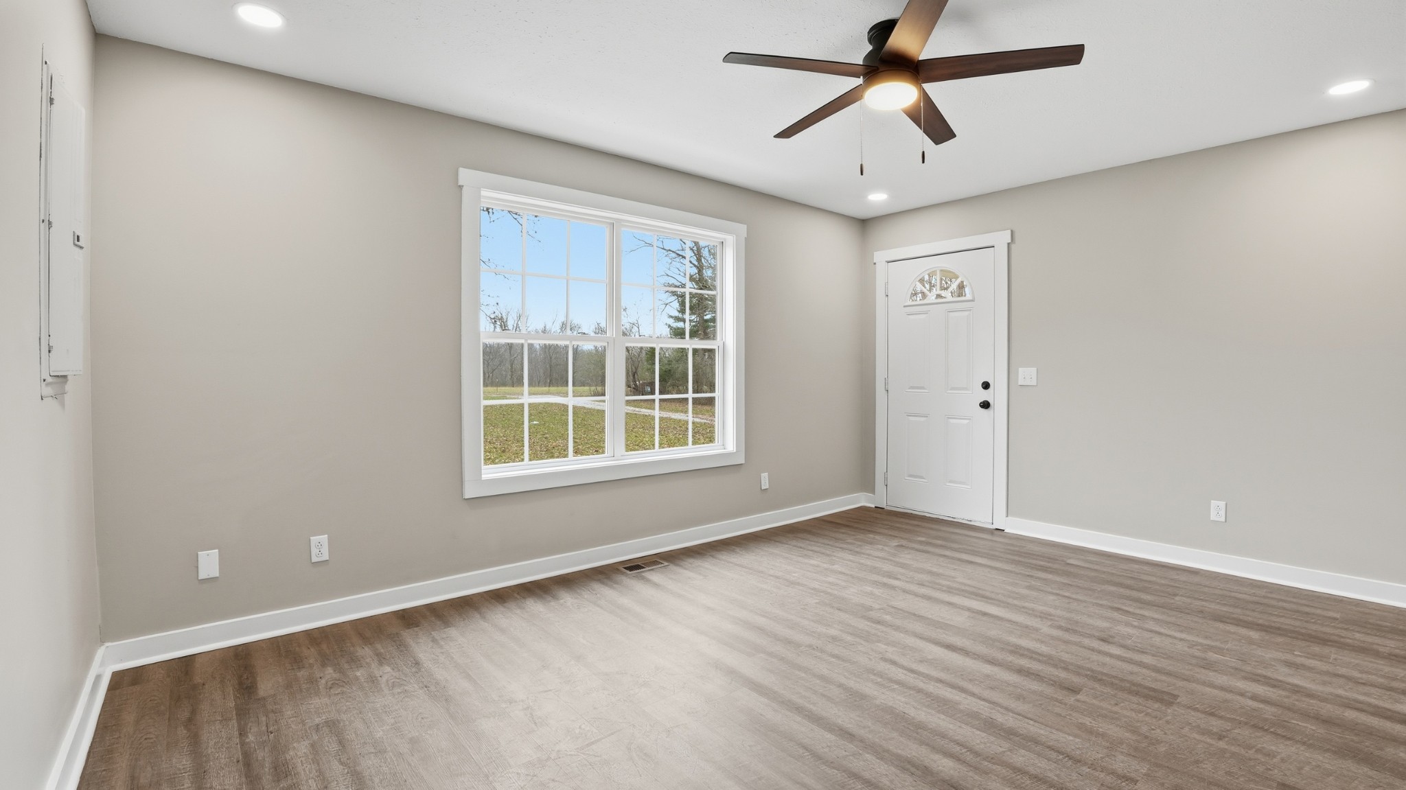 790 Preston Ridge Road Mulberry, TN 37359 - Photo 10 of 44 a view of an empty room with a window and a ceiling fan