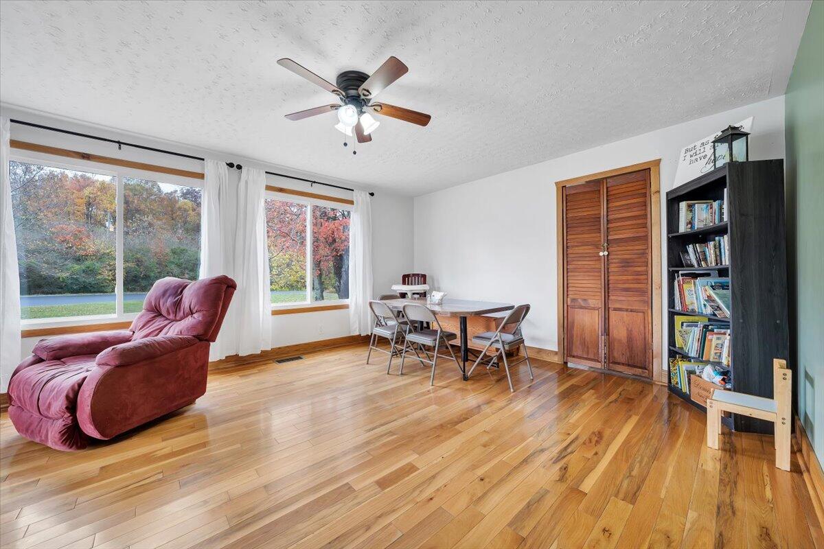 1122 Barberry Road Southeast Floyd, VA 24091 - Photo 25 of 39 a living room with furniture and a wooden floor