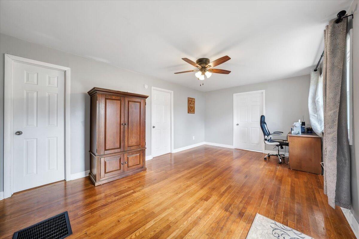1122 Barberry Road Southeast Floyd, VA 24091 - Photo 3 of 39 a view of livingroom with hardwood floor and a ceiling fan