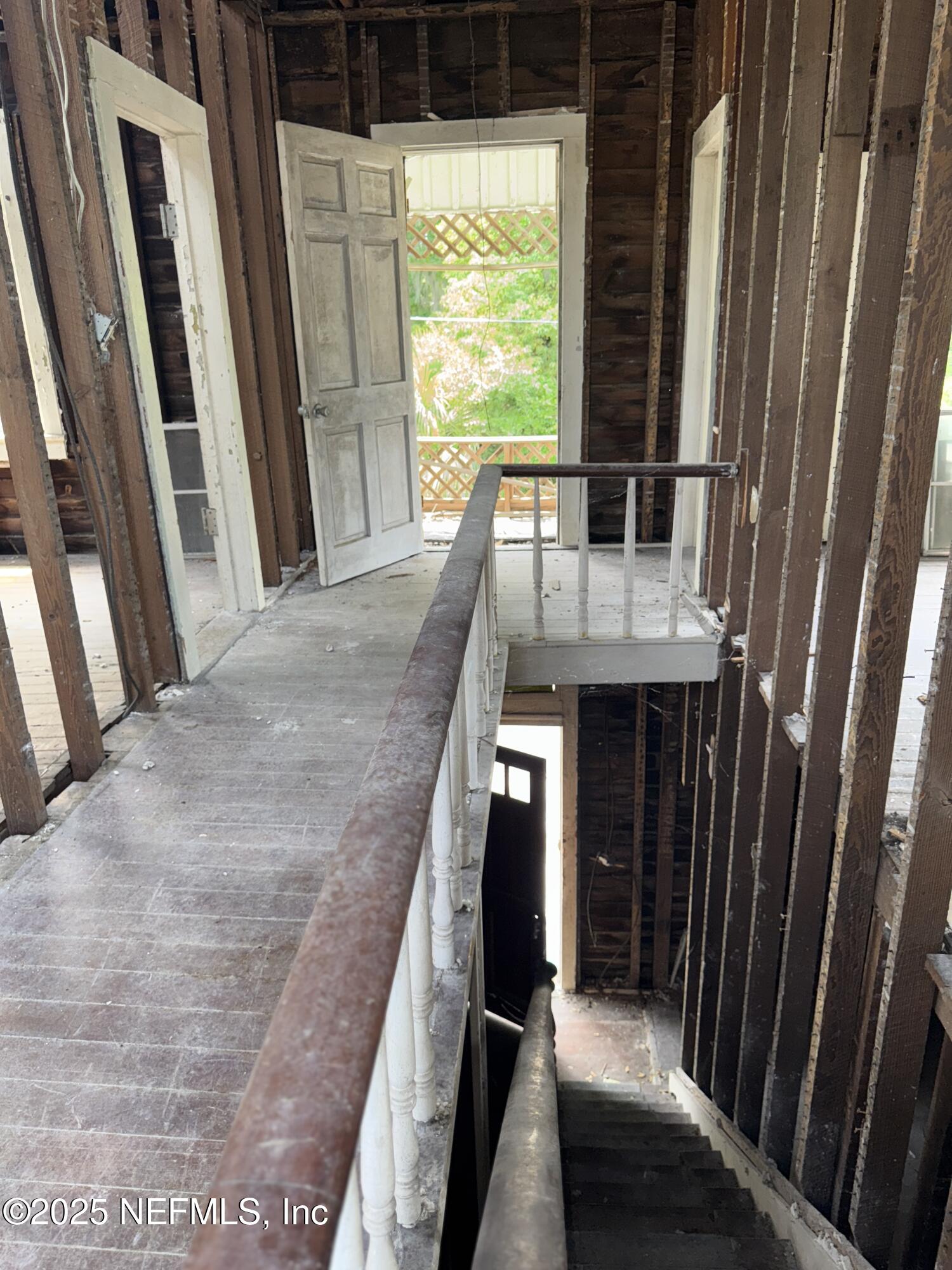 95 Oneida Street St. Augustine, FL 32084 - Photo 15 of 15 a view of a balcony with furniture and wooden floor