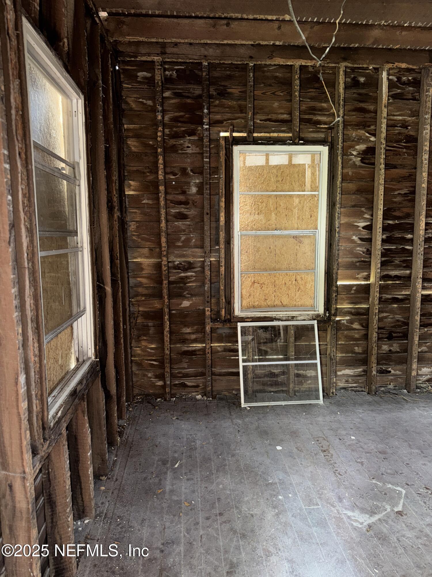 95 Oneida Street St. Augustine, FL 32084 - Photo 4 of 15 a view of an empty room with furniture and a window