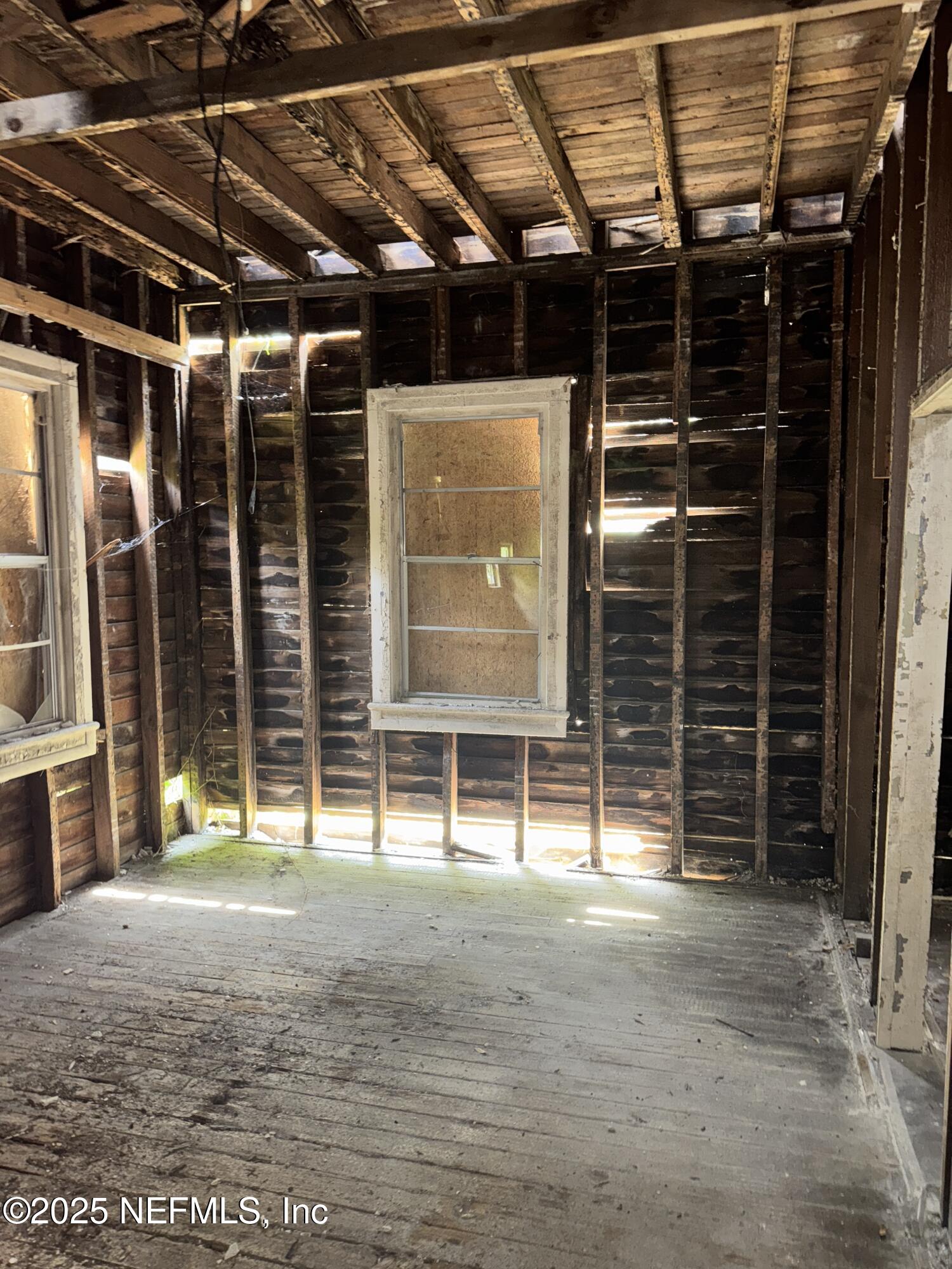 95 Oneida Street St. Augustine, FL 32084 - Photo 7 of 15 a view of empty room with wooden floor and windows