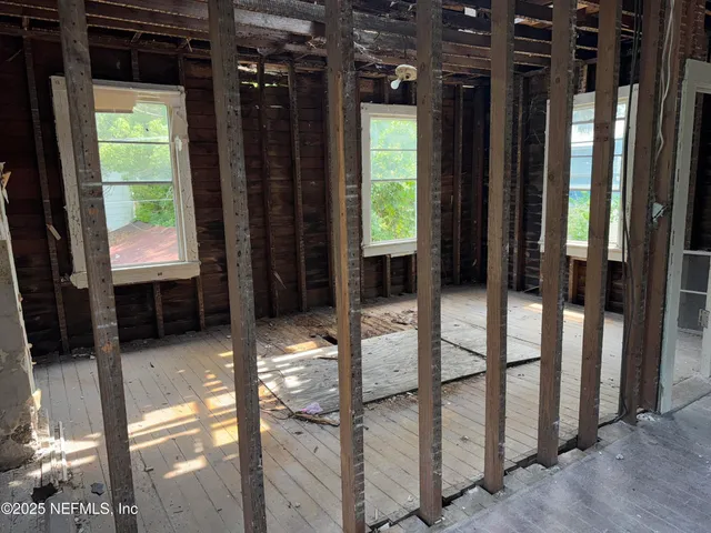 a view of empty room with windows