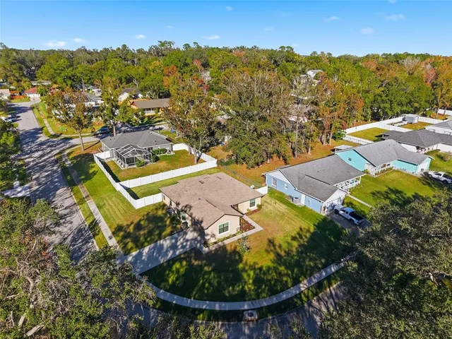 an aerial view of residential houses with outdoor space
