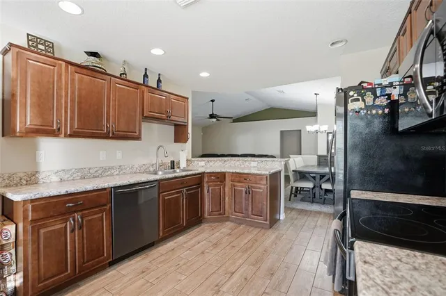 a kitchen with lots of counter top space and appliances
