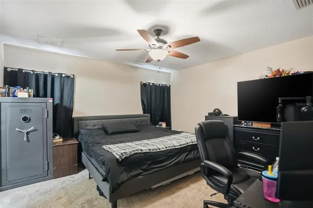 a bedroom with a bed and furniture