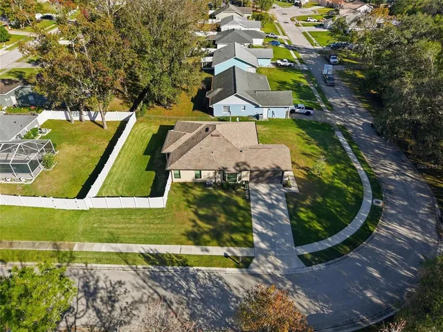 an aerial view of a house with outdoor space