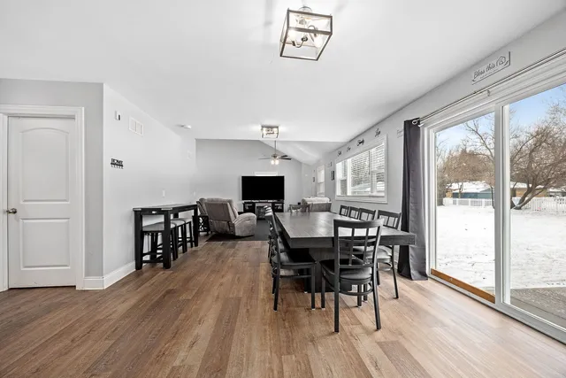 a view of a dining room with furniture window and wooden floor