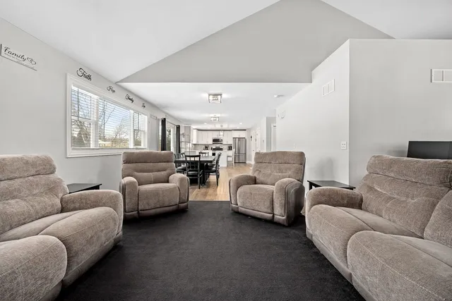 a living room with furniture and windows