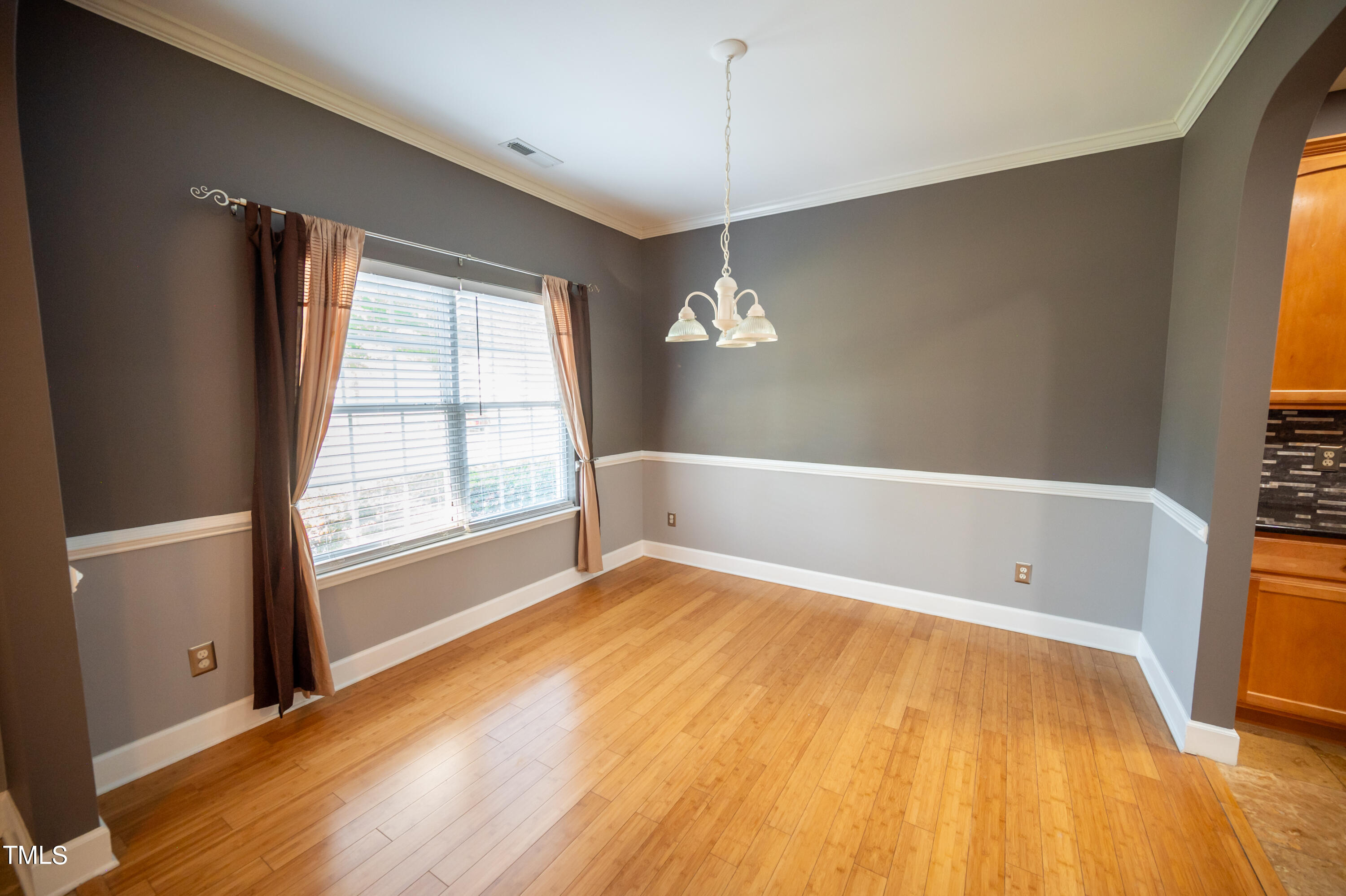 5308 Neuse Forest Road Raleigh, NC 27616 - Photo 12 of 26 a spacious bathroom with a bathtub and wooden floor