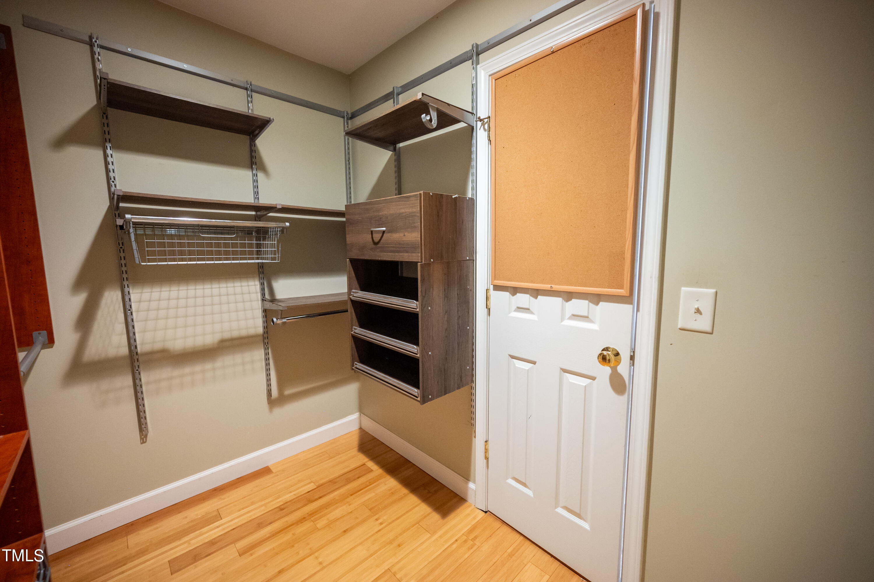 5308 Neuse Forest Road Raleigh, NC 27616 - Photo 16 of 26 a view of walk in closet with empty racks