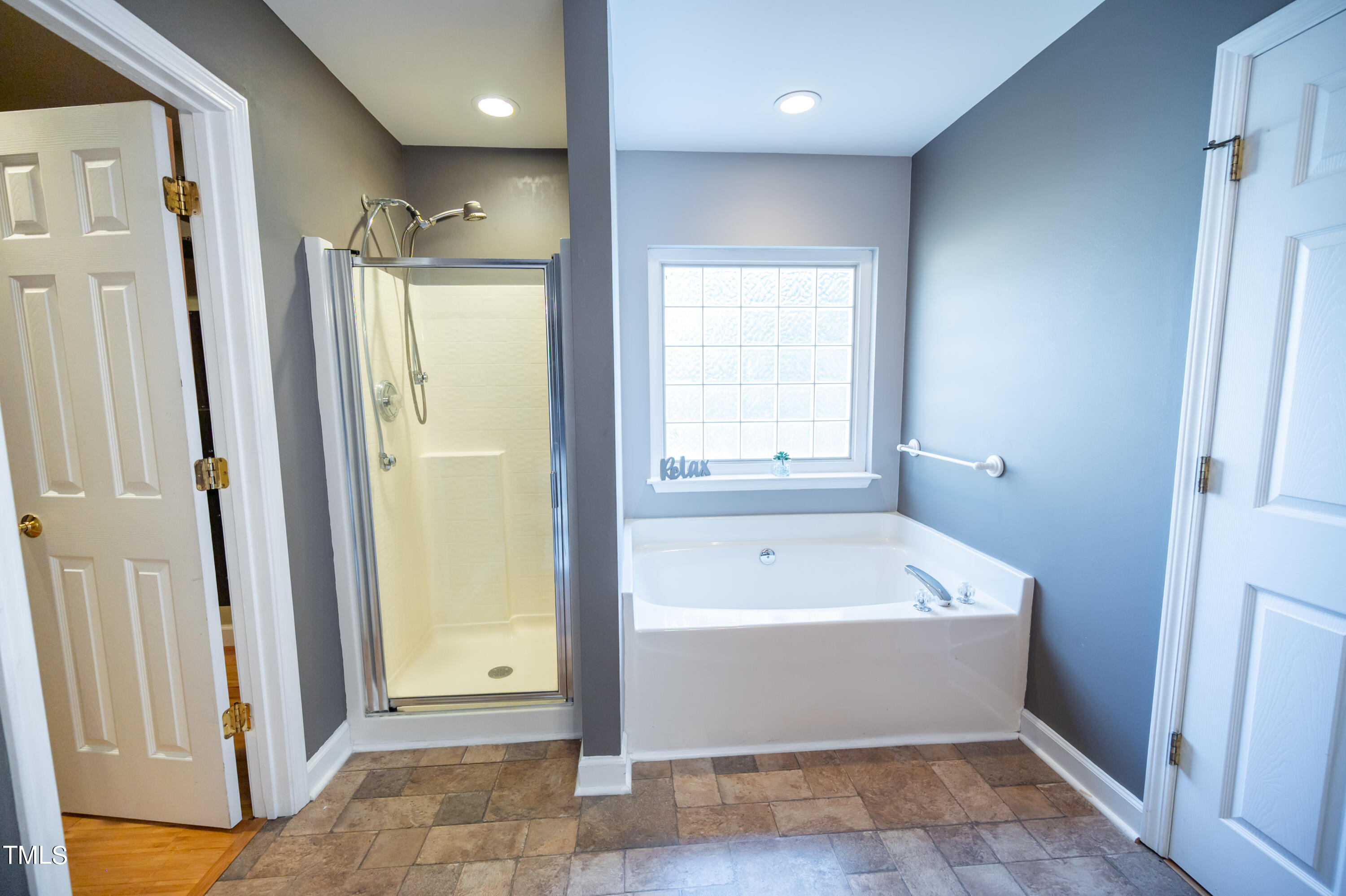 5308 Neuse Forest Road Raleigh, NC 27616 - Photo 18 of 26 a view of bathroom with bathtub and shower
