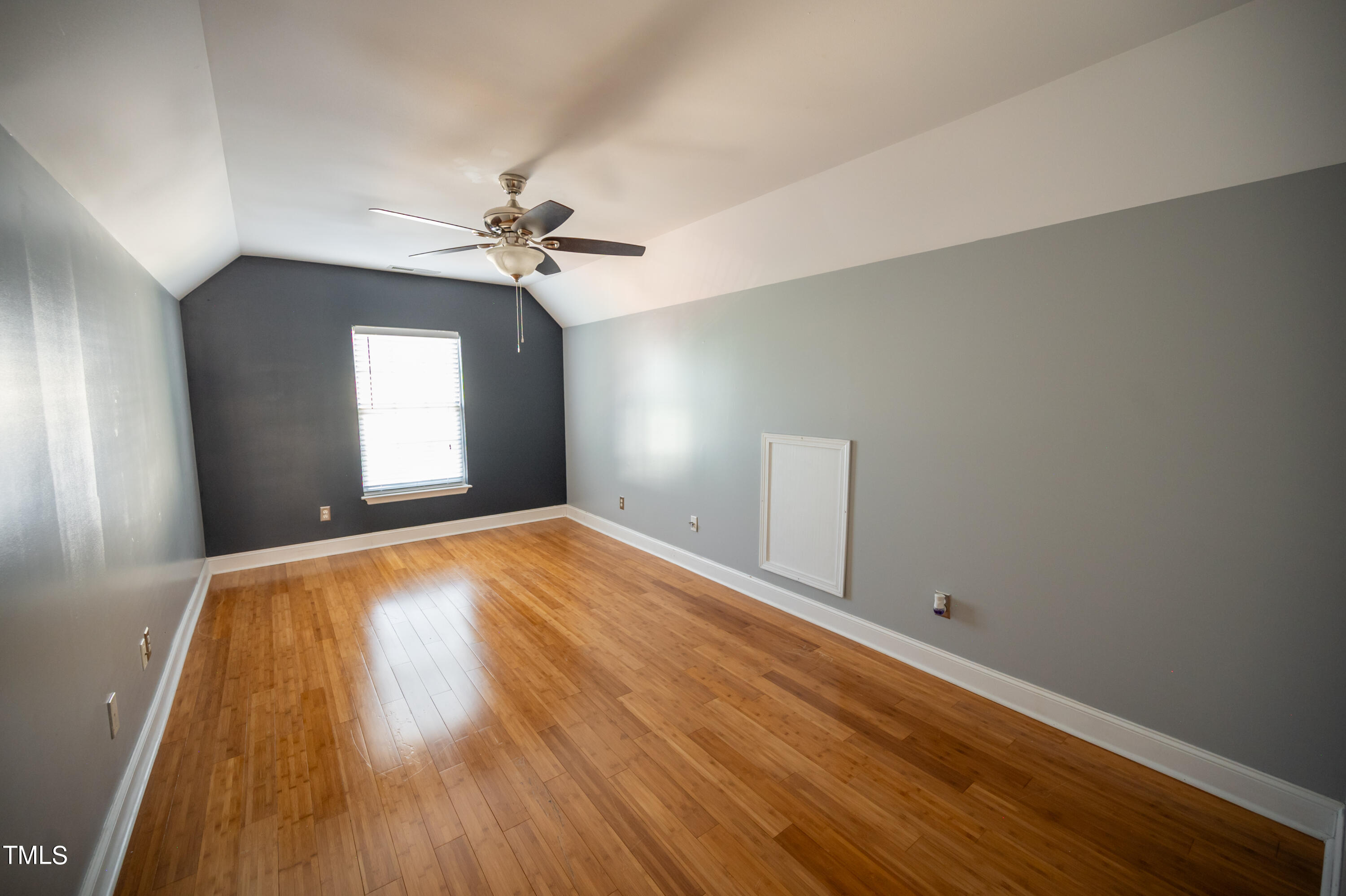 5308 Neuse Forest Road Raleigh, NC 27616 - Photo 21 of 26 wooden floor in an empty room with a window