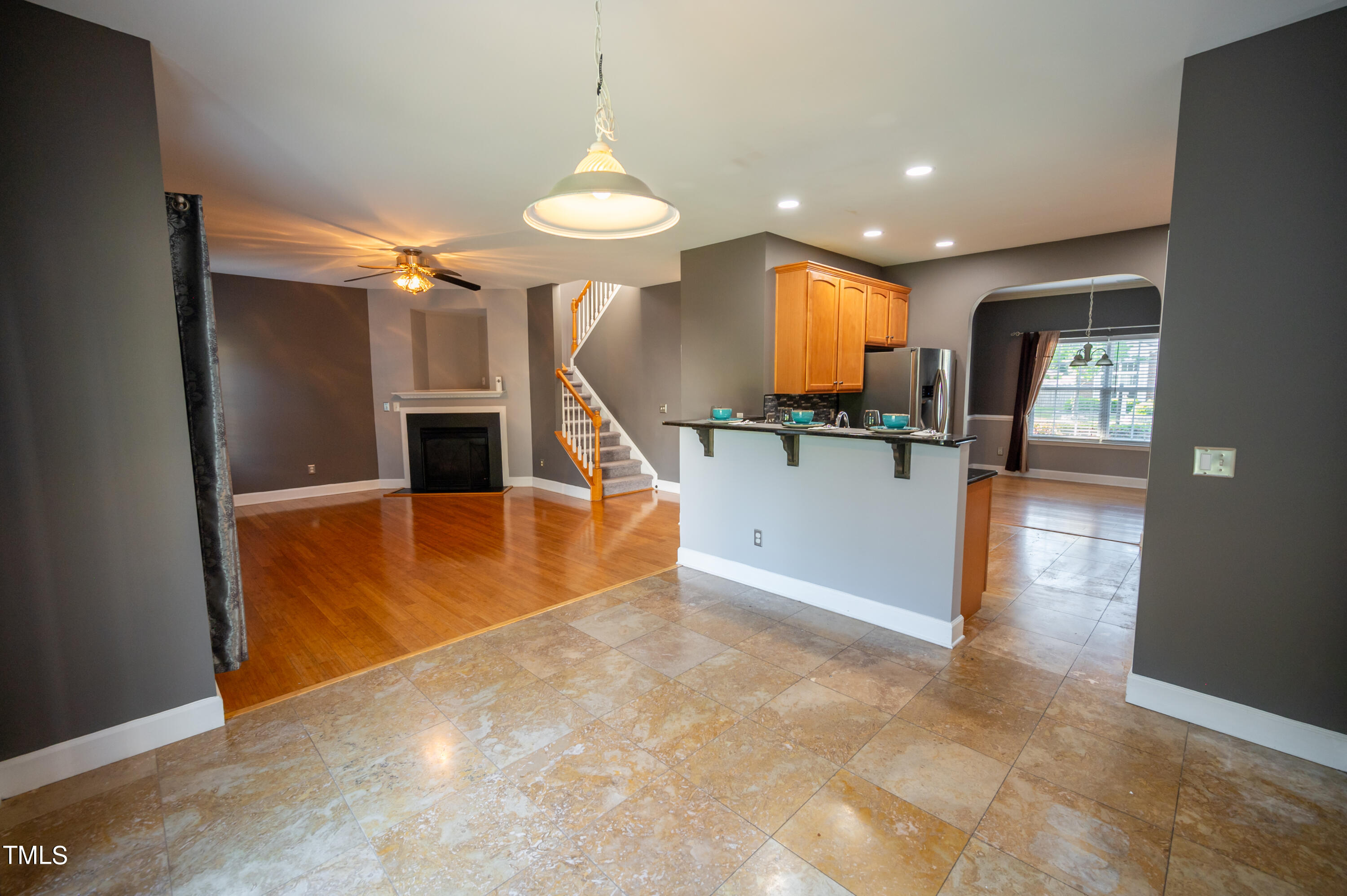 5308 Neuse Forest Road Raleigh, NC 27616 - Photo 10 of 26 a view of kitchen and dining room with chandelier