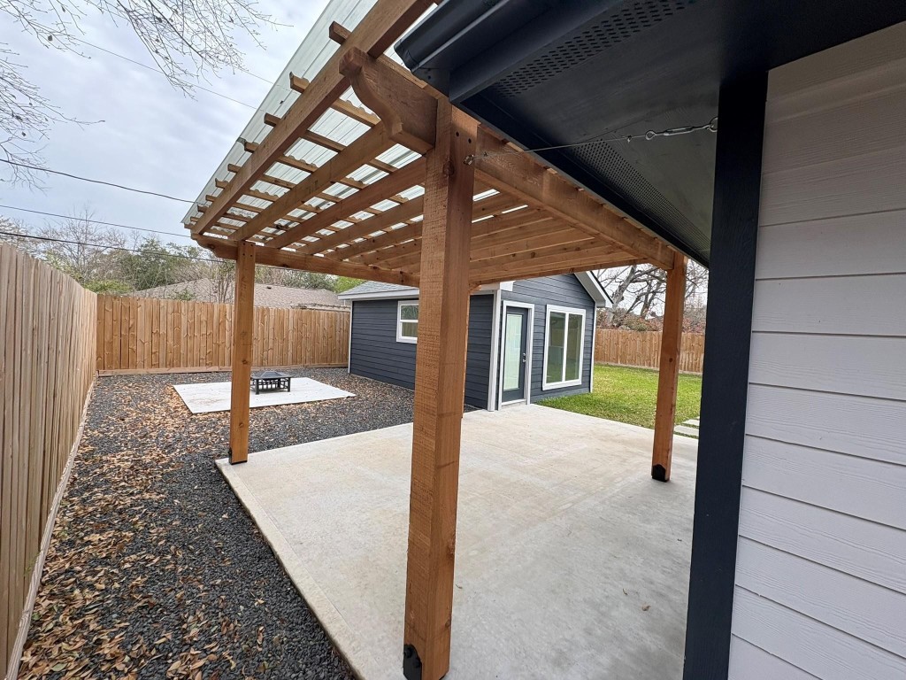 5534 Pagewood Lane Houston, TX 77056 - Photo 10 of 12 Patio with covered pergola, fire pit area, spacious backyard and multipurpose flex-space with 1-ton split HVAC.
