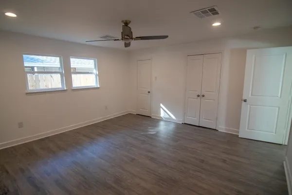 a kitchen with kitchen island stainless steel appliances a sink and a stove