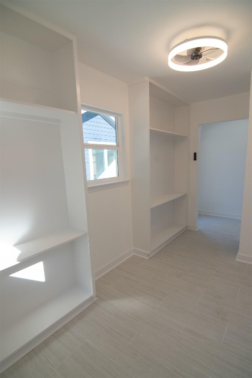 5534 Pagewood Lane Houston, TX 77056 - Photo 9 of 12 Full size utility room with floor to ceiling shelving