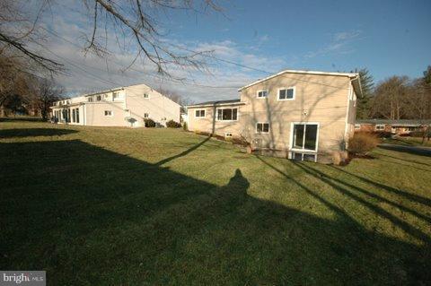 7405 Kathydale Road Pikesville, MD 21208 - Photo 16 of 29 a view of a big yard with table and chairs in it