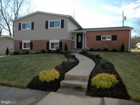7405 Kathydale Road Pikesville, MD 21208 - Photo 17 of 29 a front view of a house with garden