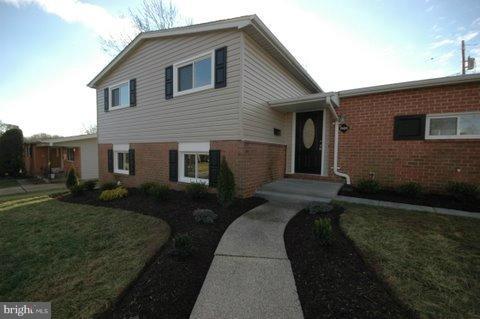7405 Kathydale Road Pikesville, MD 21208 - Photo 3 of 29 a front view of a house with a garden